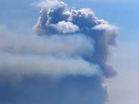 cluculz smoke8x12 8511  cluculz smoke e-mailed dave milne may 30 05 A coumn of smoke towers into the sky south of Cluculz Lake Monday afternoon.  LAKE AT BOTTOM OF PHOTO